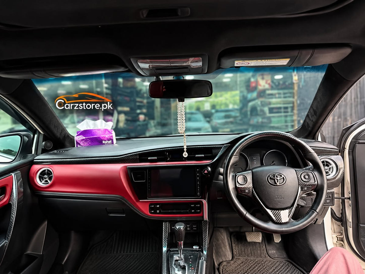Toyota Corolla 2015-2027 carbon fiber interior kit installed on dashboard – Carzstore.pk